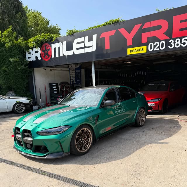 Green BMW M3 outside Bromley Tyres